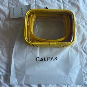 CALPAK small clear cosmetics case yellow, NWT